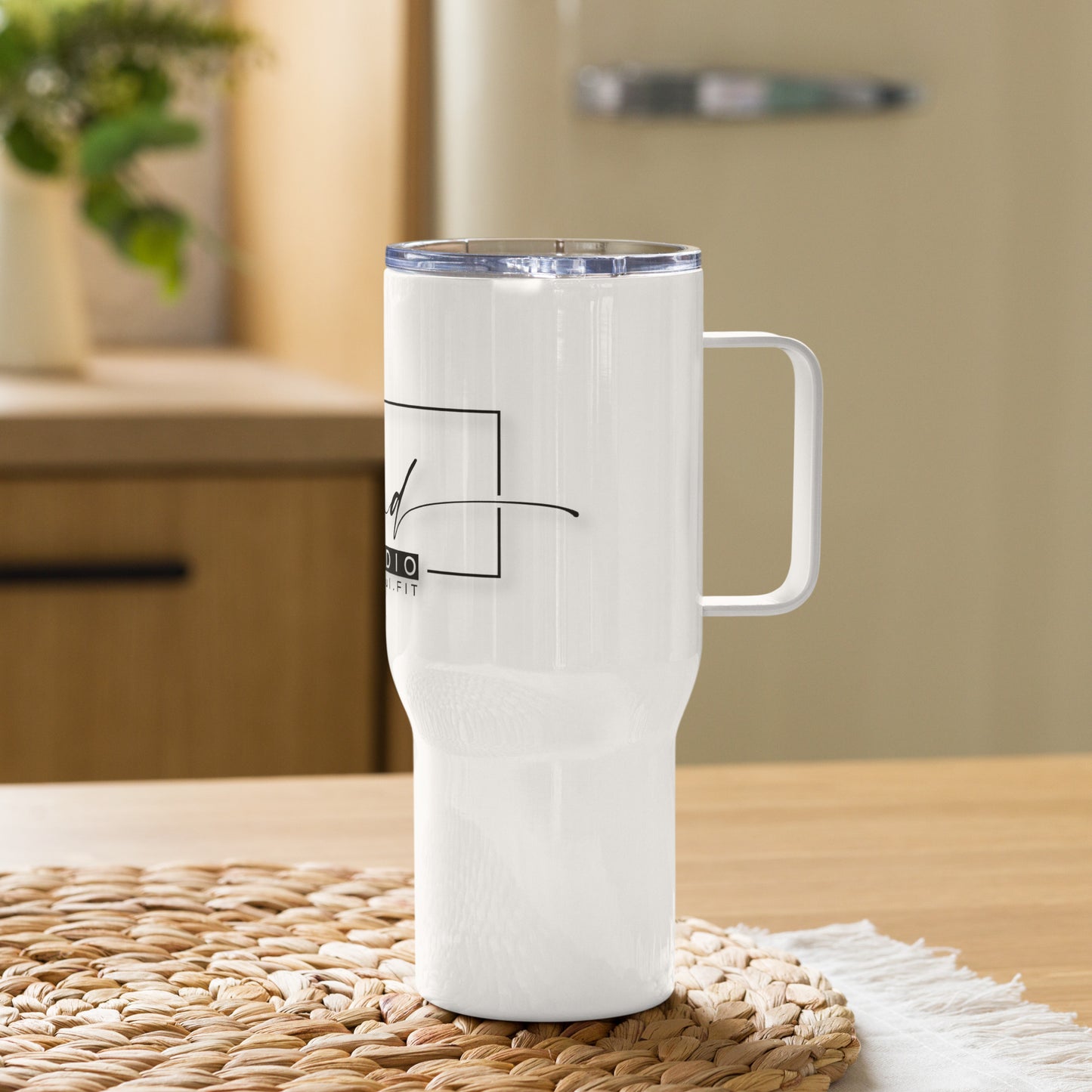 Ascend FIT Studio Travel mug with a handle